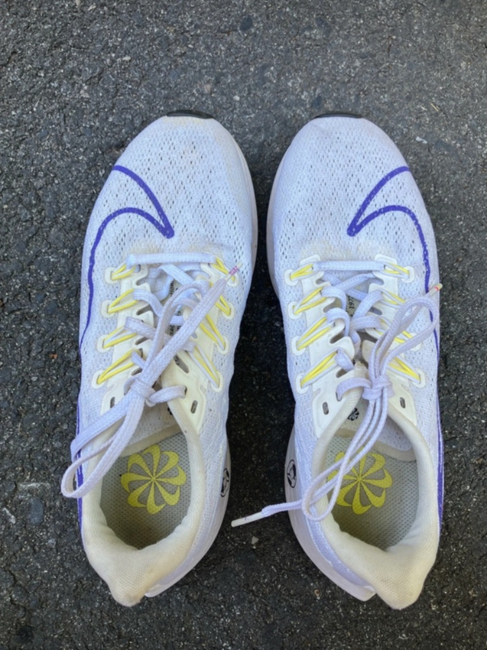 Nike Women’s White Athletic Shoes with Purple Swoosh and Yellow Accents